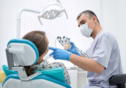 Healthy mouth getting gums measured by dentist.